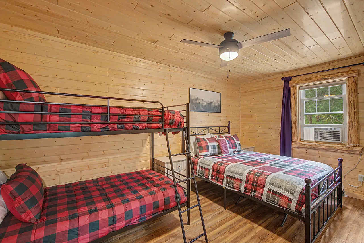 Plaid bunk beds in the pine bunkhouse