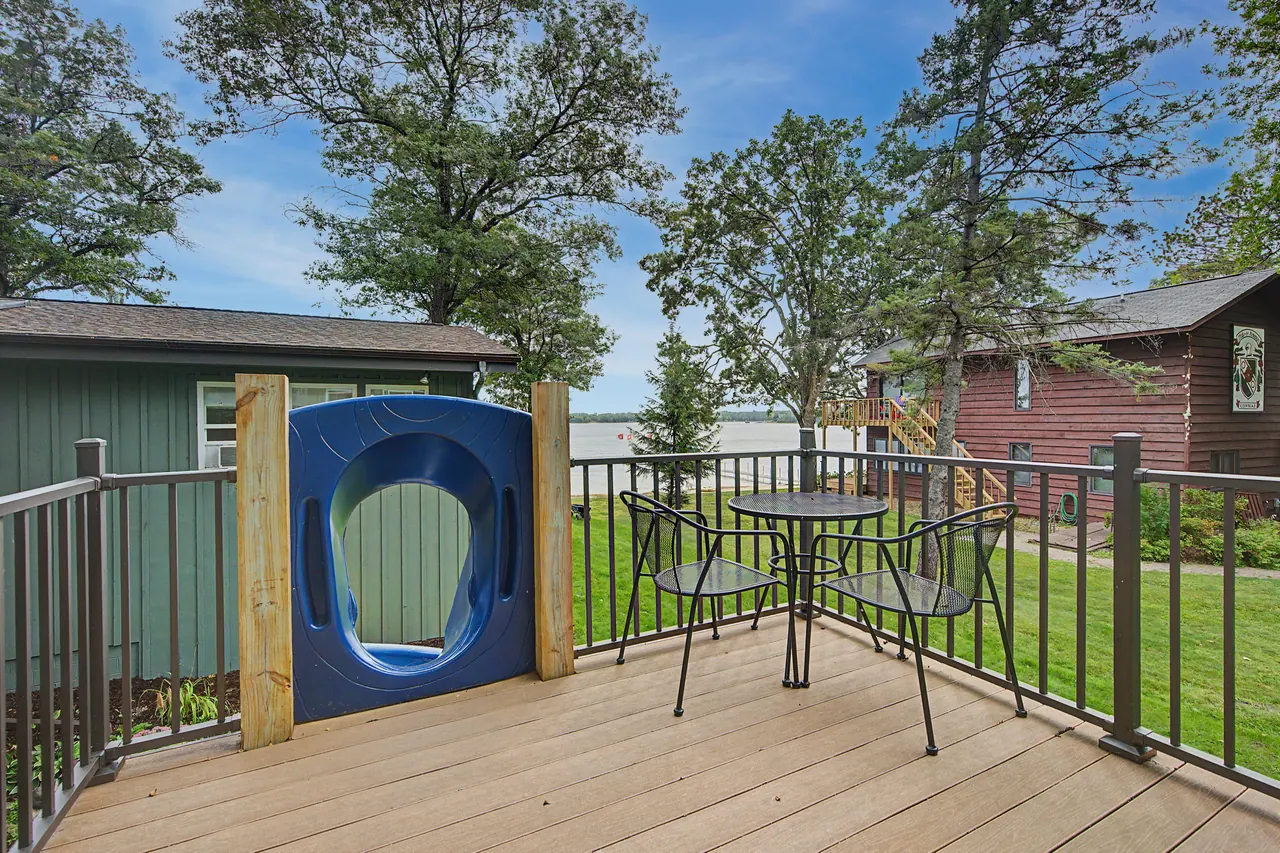 Bunkhouse deck with the slide and a view of the lake