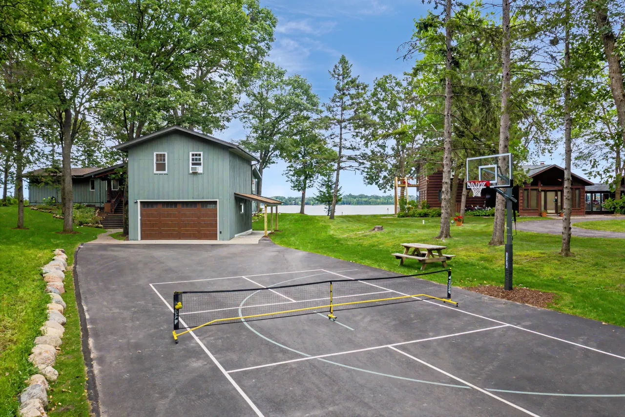 Sport court with a pickleball net and a basketball hoop